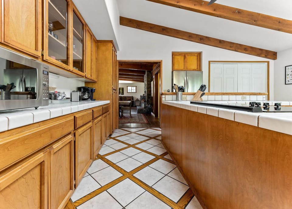 A substantial kitchen, well stocked with cooking and baking gear.