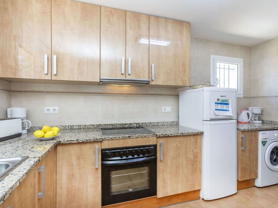Flooring, Cabinetry, Kitchen, Countertop, Wood, Major Appliance, Floor, Interior Design, Furniture, Kitchen Appliance
