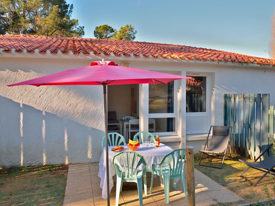Sky, Property, Furniture, Table, Shade, Outdoor Table, Outdoor Furniture, Chair, Window, Building