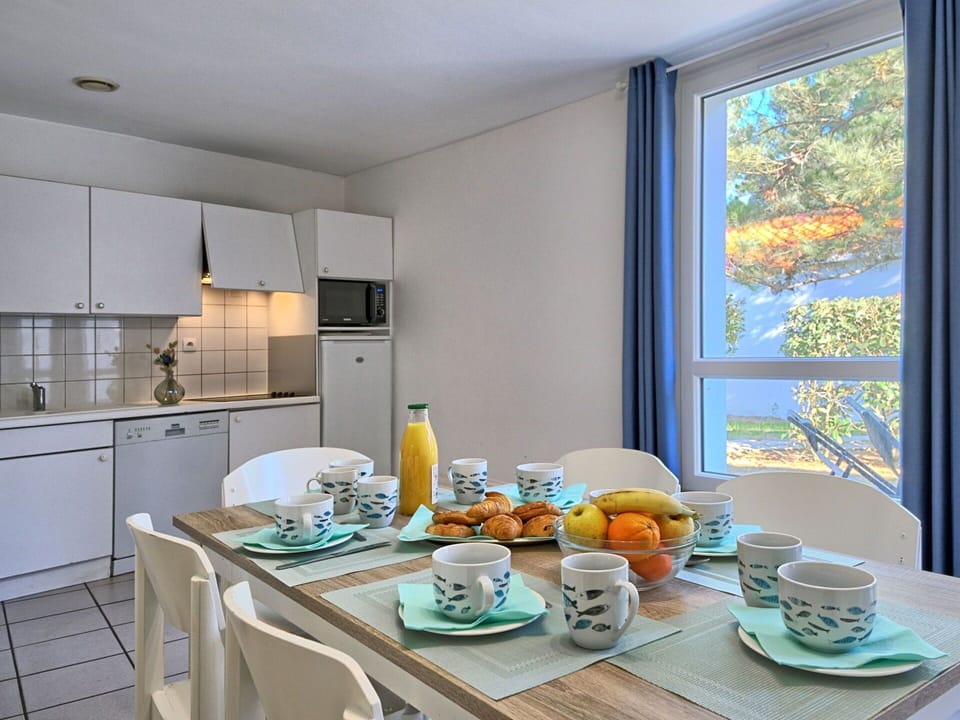 Tableware, Table, Property, Cabinetry, Furniture, Dishware, Food, Azure, Countertop, Window