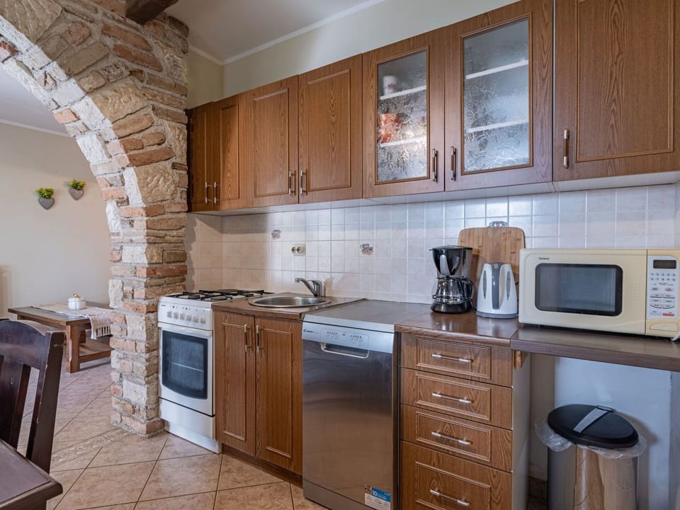 Kitchen, Kitchen Appliance, Furniture, Countertop, Major Appliance, Cabinetry, Flooring, Interior Design, Cupboard, Room
