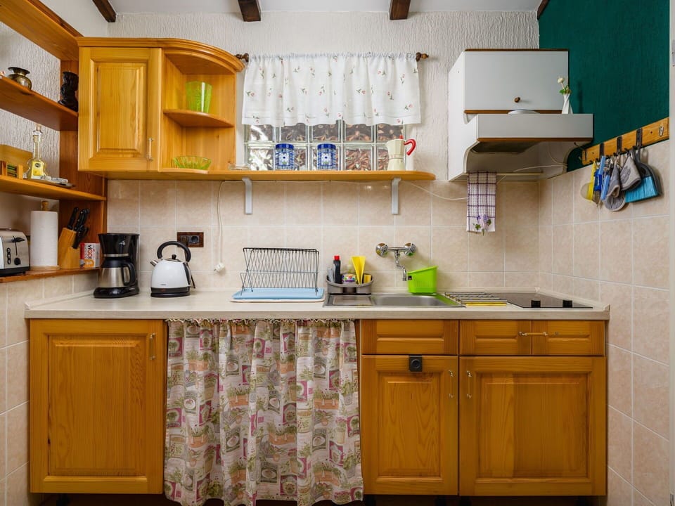 Kitchen, Cabinetry, Kitchen Appliance, Countertop, Major Appliance, Interior Design, Wood, Furniture, Yellow, Cupboard