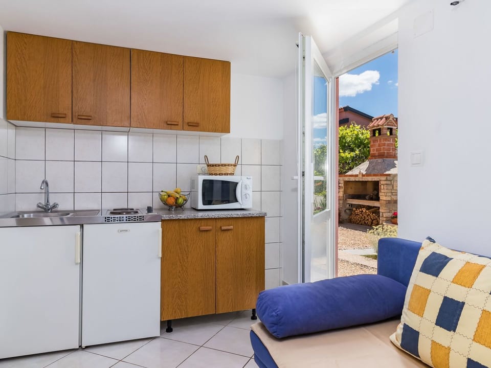 Room, Furniture, Property, Kitchen, Interior Design, Yellow, Cabinetry, Building, House, Floor