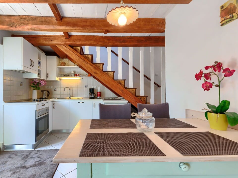 Property, Furniture, Plant, Cabinetry, Table, Building, Wood, Interior Design, Flower, Orange