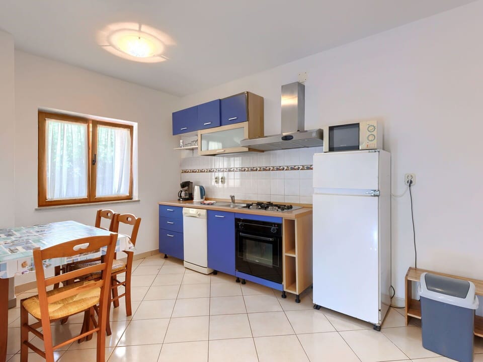 Cabinetry, Countertop, Furniture, Window, Kitchen Stove, Kitchen Appliance, Kitchen, Wood, Home Appliance, Table