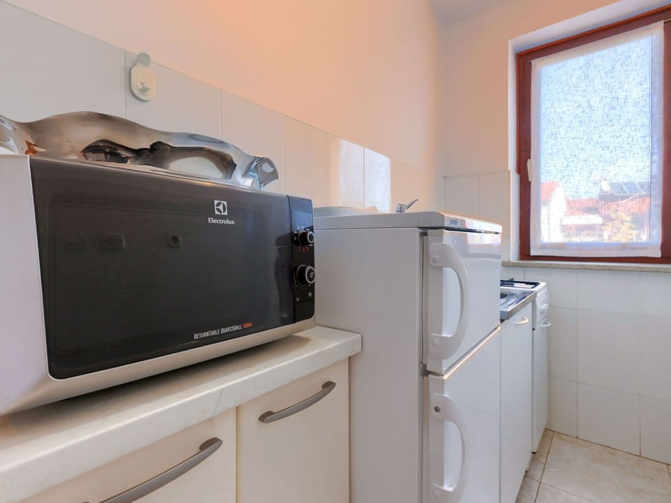 Laundry Room, Cabinetry, Window, Kitchen Appliance, Building, Home Appliance, Floor, Kitchen Stove, Wood