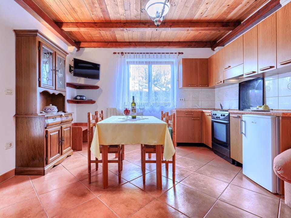 Interior Design, Flooring, Ceiling, Floor, Furniture, Room, Cabinetry, Kitchen, Wood Stain, Countertop