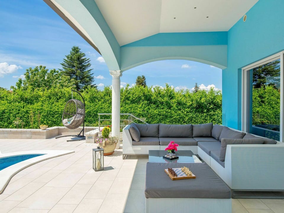 Property, Furniture, Plant, Couch, Sky, Building, Azure, Shade, Interior Design, Architecture