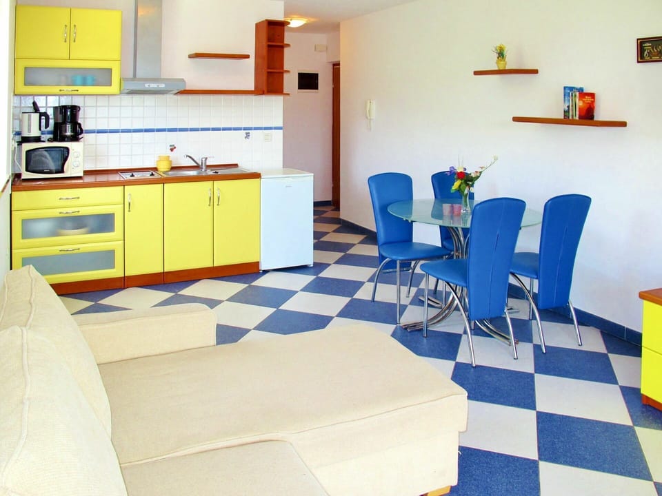 Room, Yellow, Furniture, Property, Floor, Blue, Interior Design, Turquoise, Orange, Table