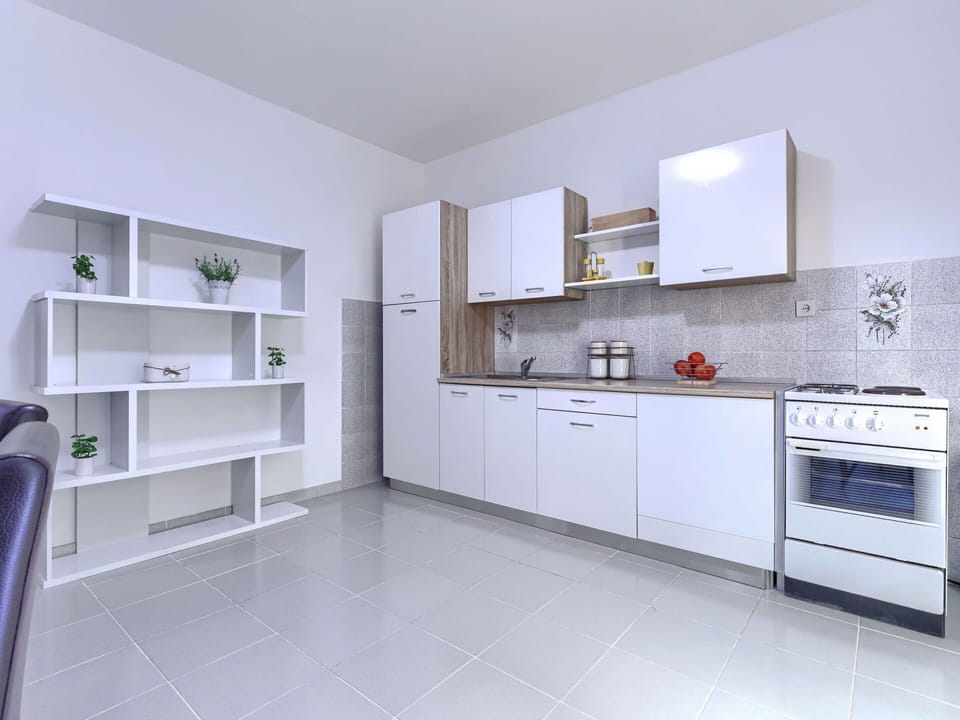 Flooring, Interior Design, Floor, Ceiling, Room, Furniture, Cabinetry, Kitchen, Major Appliance, Apartment