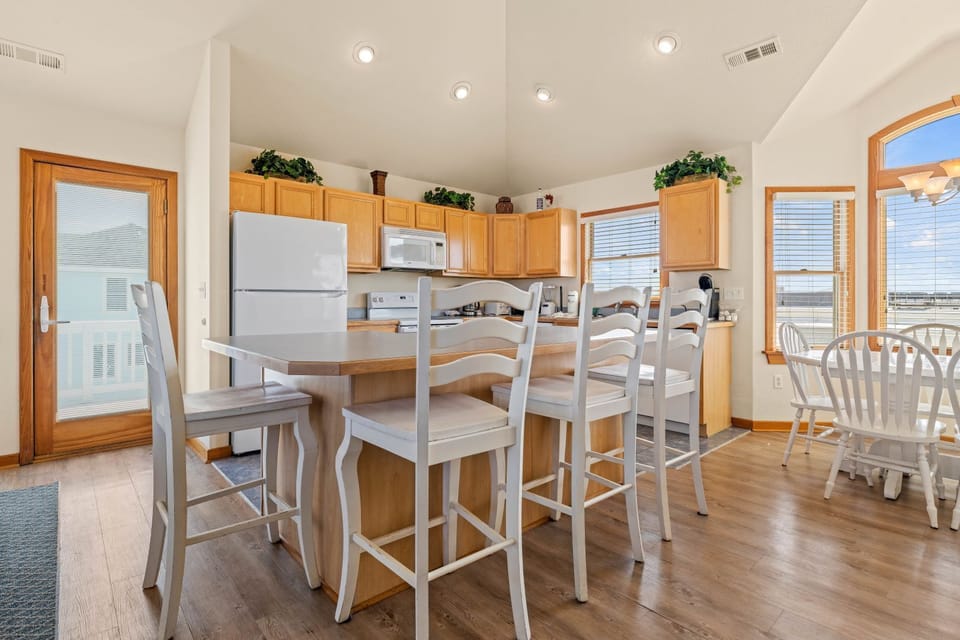 Kitchen with Bar Seating on Third Level