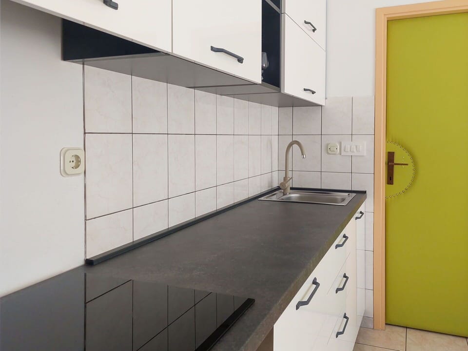 Kitchen, Countertop, Flooring, Kitchen Sink, Interior Design, Floor, Sink, Cabinetry, Plumbing Fixture, Tap