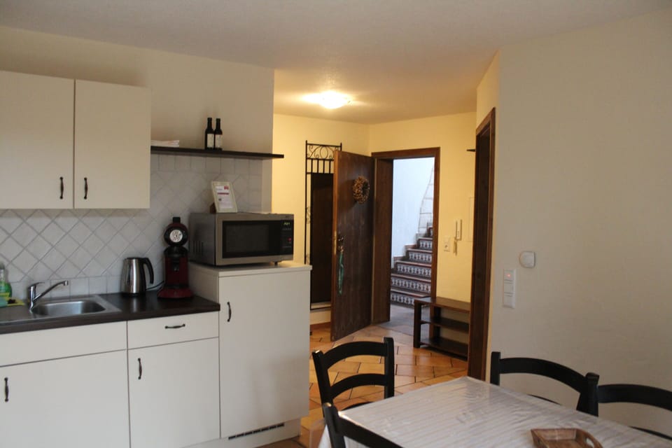 Full-size fridge, microwave, stovetop, coffee/tea maker