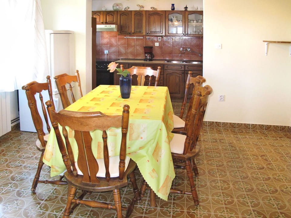 Dining Room, Room, Property, Furniture, Floor, Table, Interior Design, Chair, Yellow, Hardwood