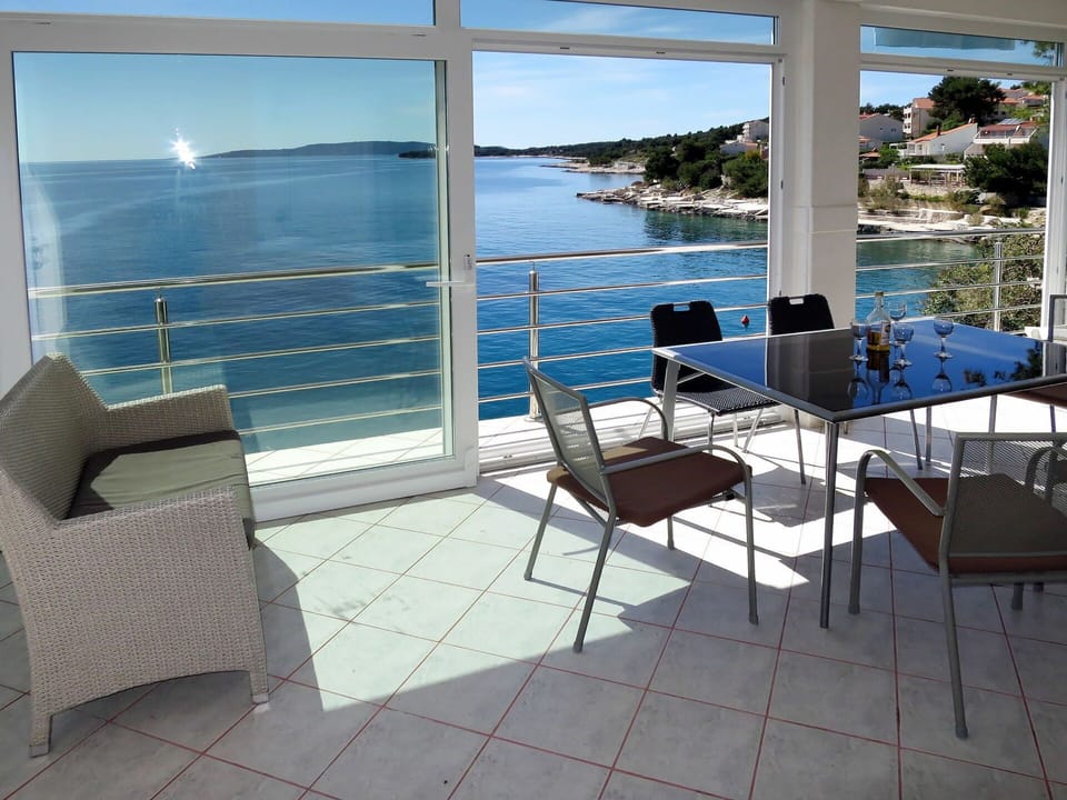 Water, Furniture, Sky, Property, Building, Blue, Chair, Shade, Outdoor Furniture, Interior Design