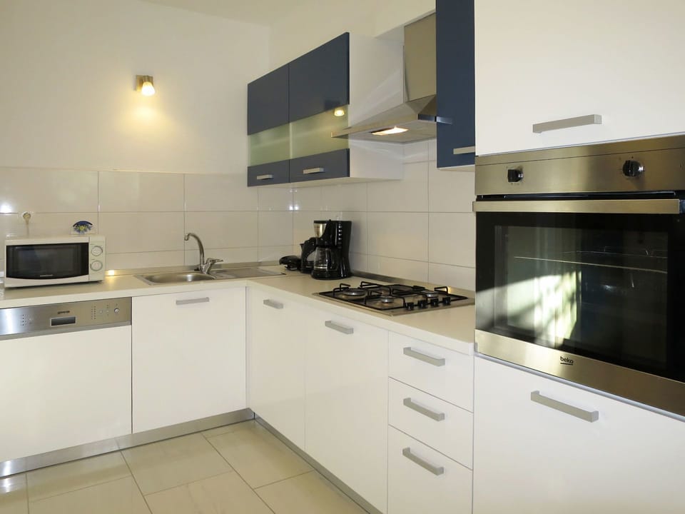 Cabinetry, Countertop, Kitchen Sink, Tap, Sink, Kitchen Stove, Cooktop, Kitchen Appliance, Gas Stove, Stove