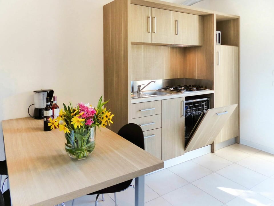 Cabinetry, Furniture, Flower, Countertop, Property, Building, Product, Table, Kitchen Appliance, Home Appliance