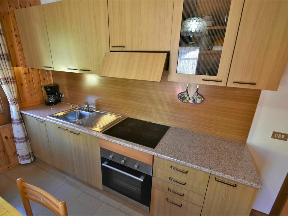 Cabinetry, Countertop, Property, Furniture, Wood, Kitchen, Interior Design, Kitchen Stove, Flooring, Floor