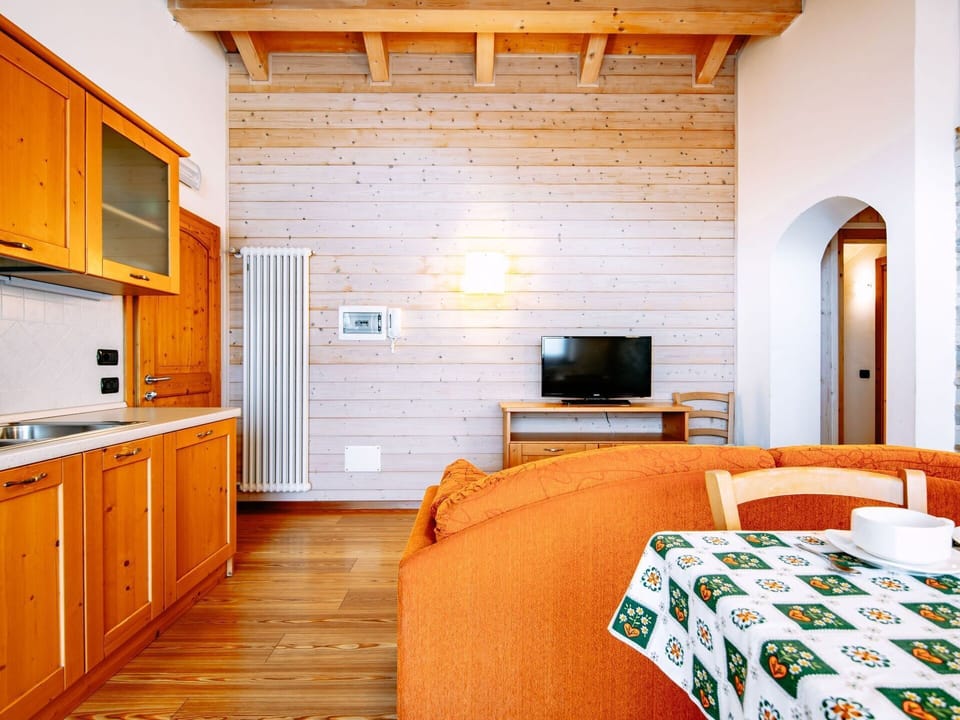 Cabinetry, Furniture, Building, Property, Wood, Comfort, Orange, Interior Design, Lighting, Drawer