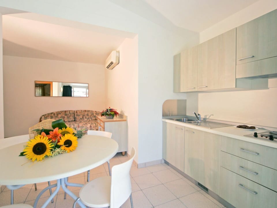 Cabinetry, Furniture, Building, Flower, Countertop, Product, Table, Sink, Interior Design, Plant