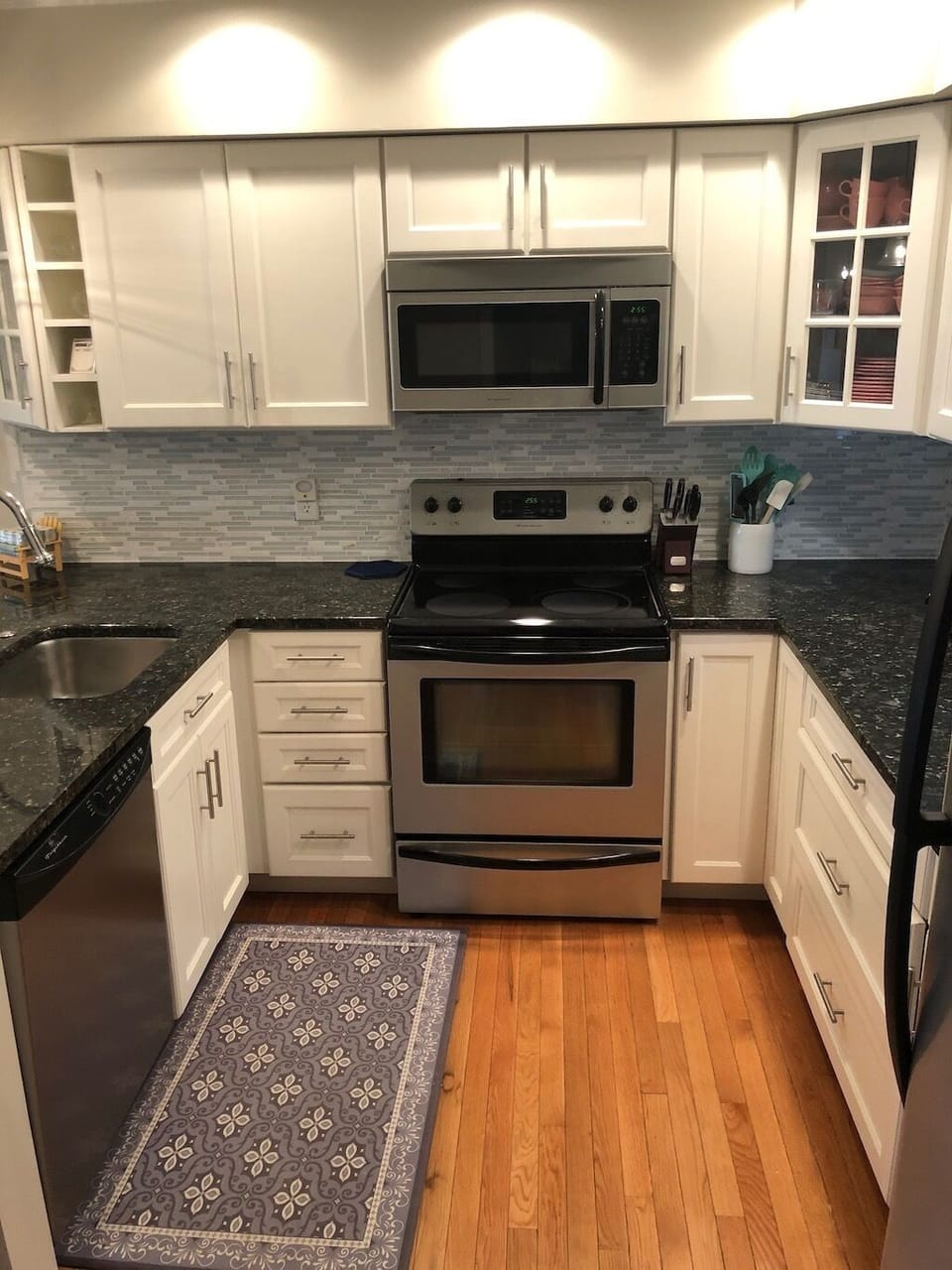 Updated kitchen with modern appliances, dishwasher, cookware, and more!