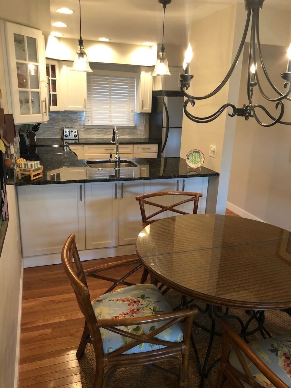 Kitchen area opens to the table for easy access and serving.