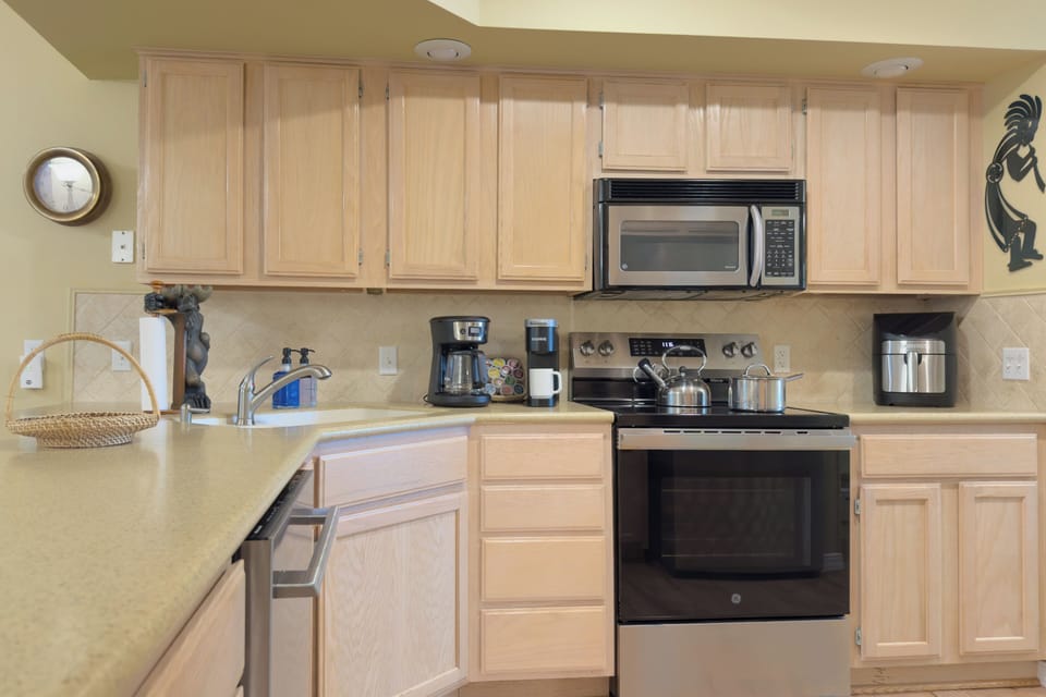 A fully equipped kitchen featuring stainless steel appliances.