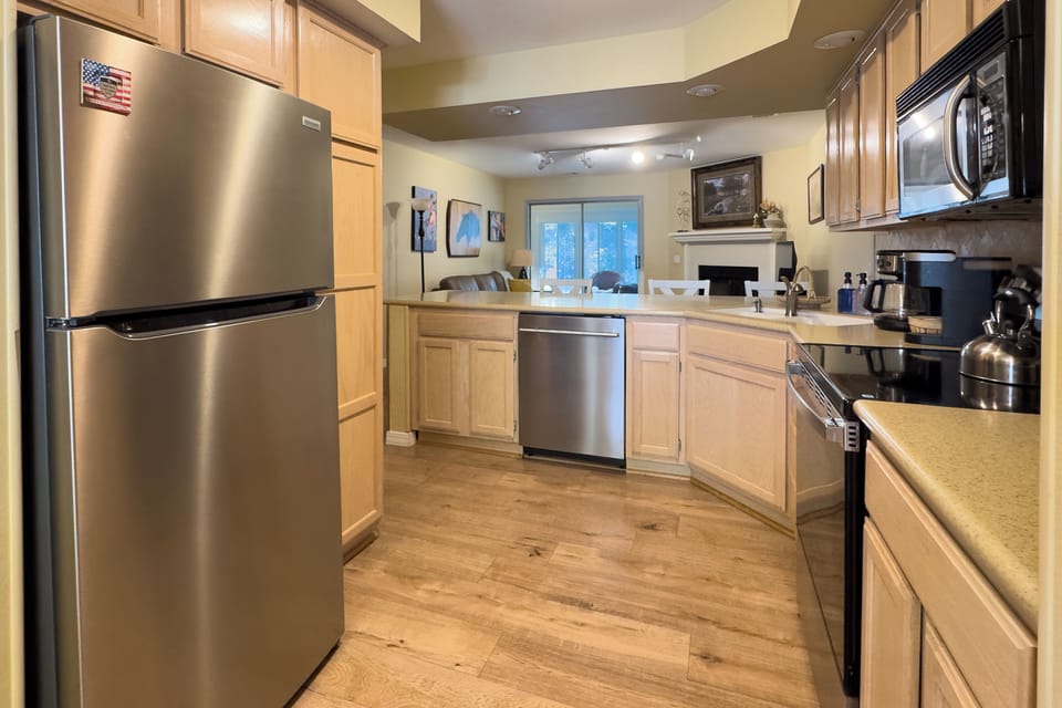 Enjoy the open-concept layout of this fully equipped kitchen.