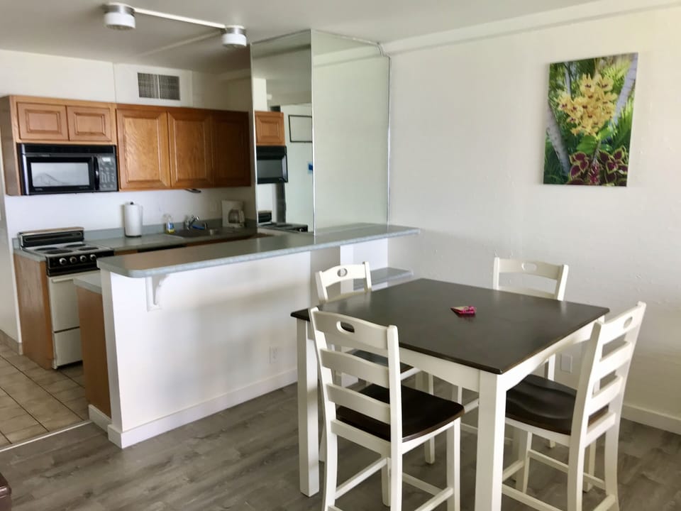 Spacious dining area with complete kitchen.