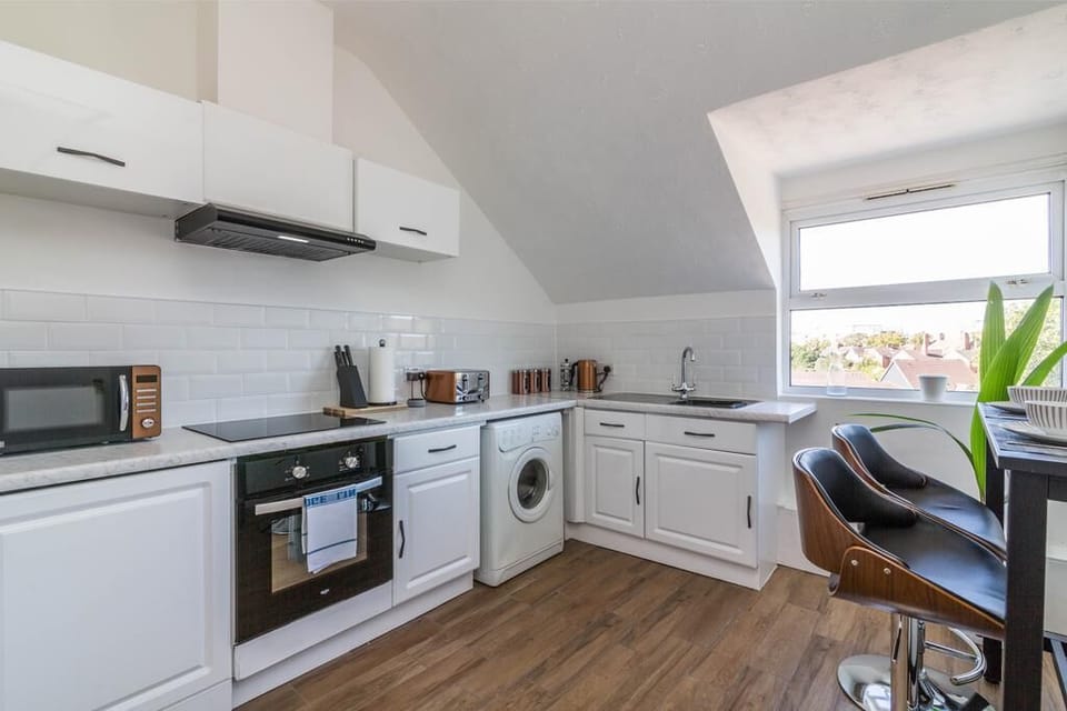 Two-Bedroom Apartment | Private kitchen | Full-size fridge, microwave, oven, stovetop
