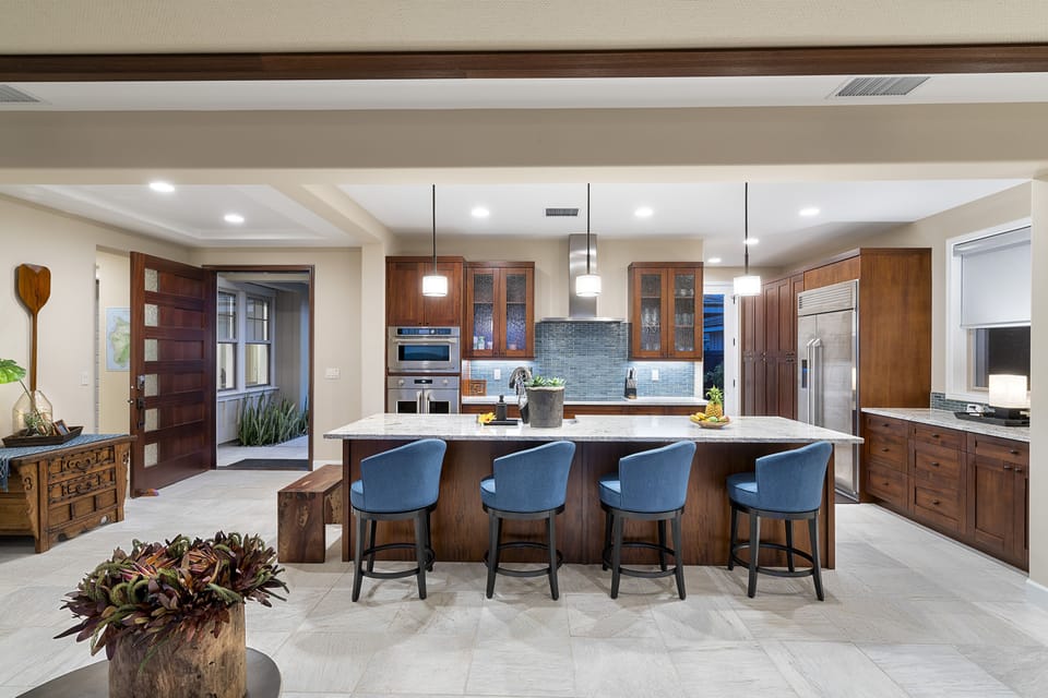 Fully equipped kitchen with center island and bar seating.