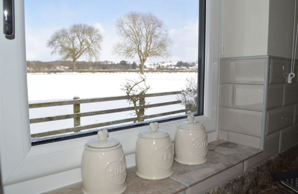 A view from the kitchen to open countryside