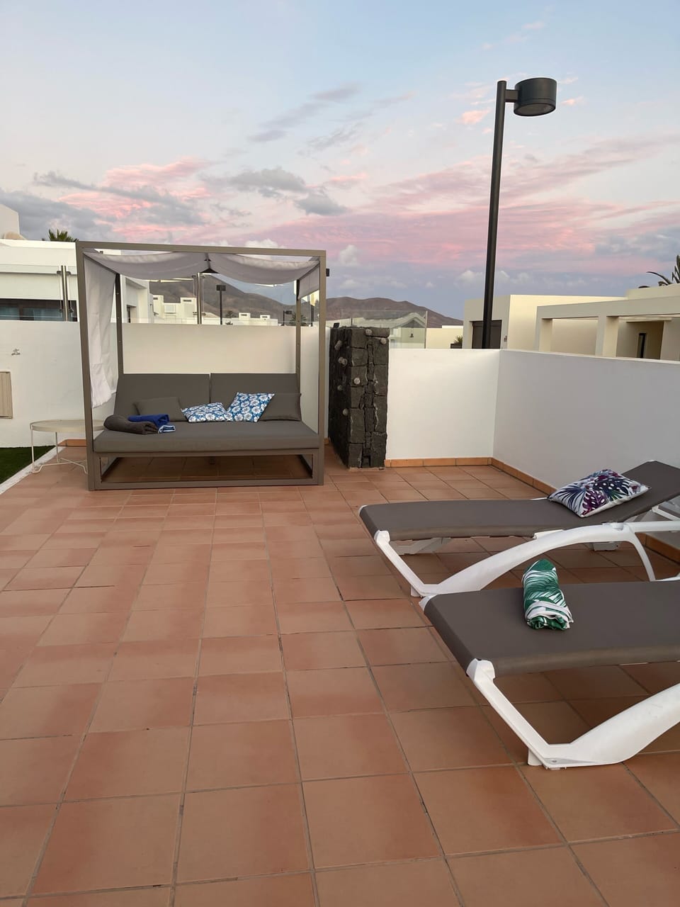 Patio and sunbed area