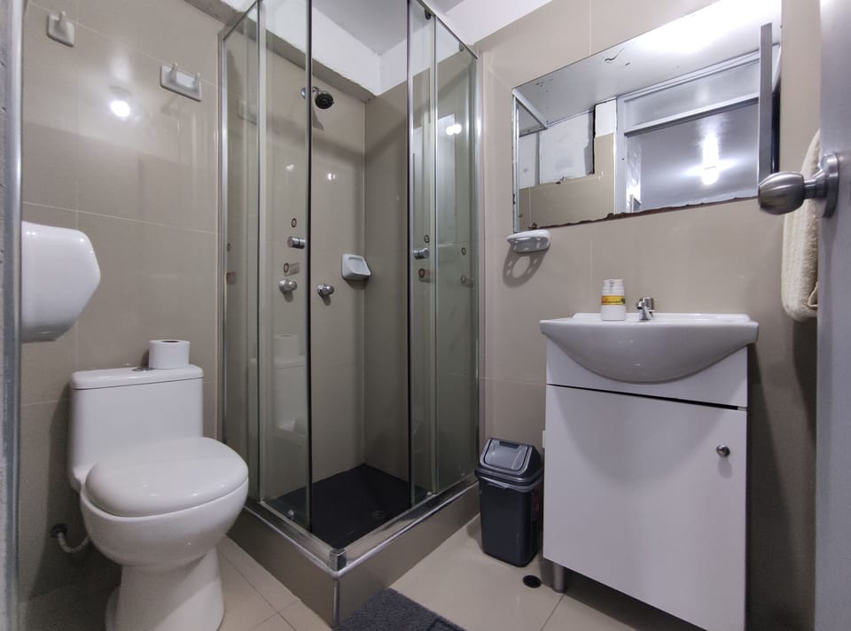 Basic Twin Room | Bathroom | Shower, rainfall showerhead, towels