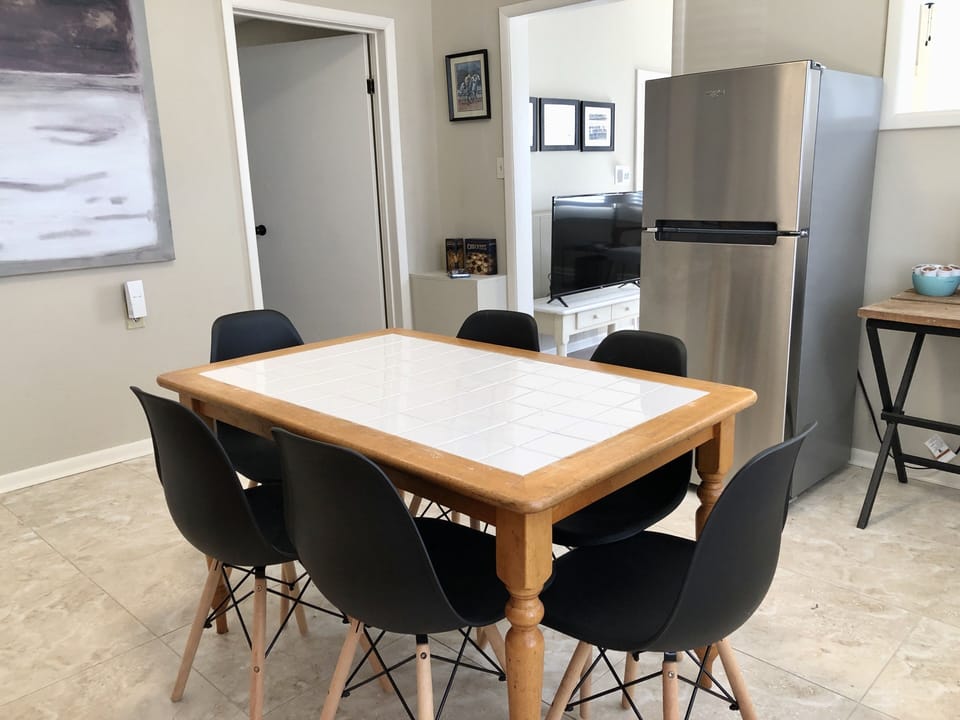 Breakfast table in kitchen area with seating for 6 people