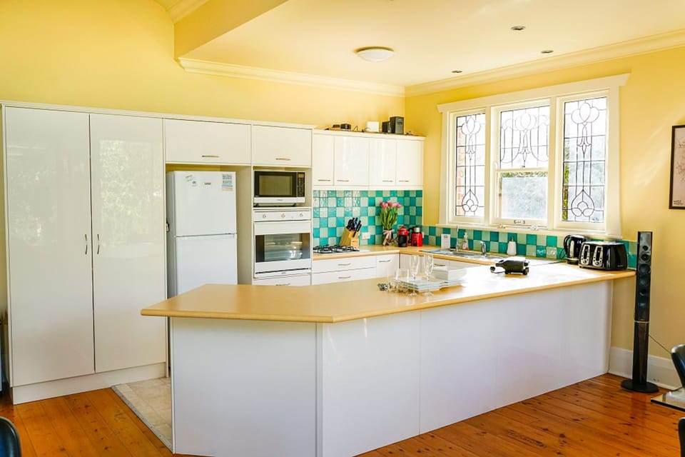 Full kitchen with fridge; stove; hotplates; utensils; dishwasher; toaster; pots