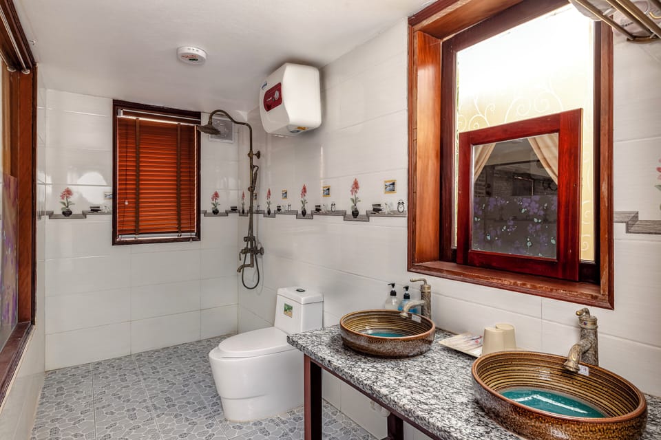 Family Room, 2 Queen Beds, Garden View | Bathroom | Shower, free toiletries, hair dryer, slippers