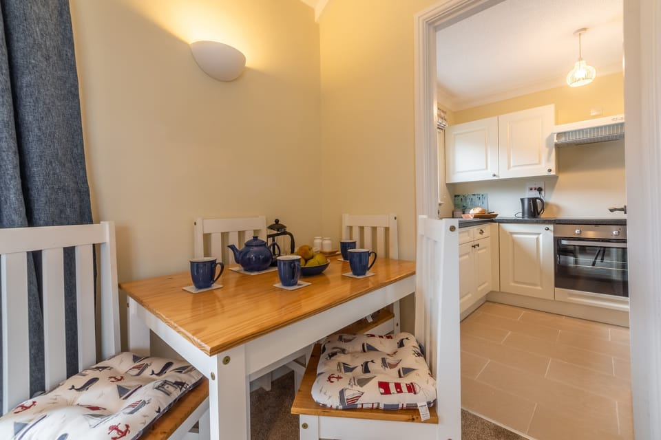 Dining area with table with seating for four