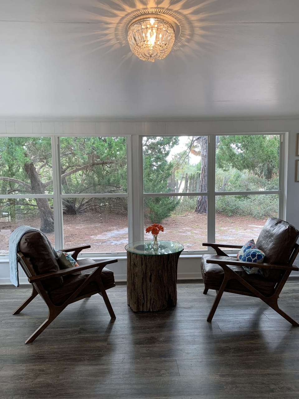 The sunroom overlooks the peaceful yard and also the way to get to the beach!