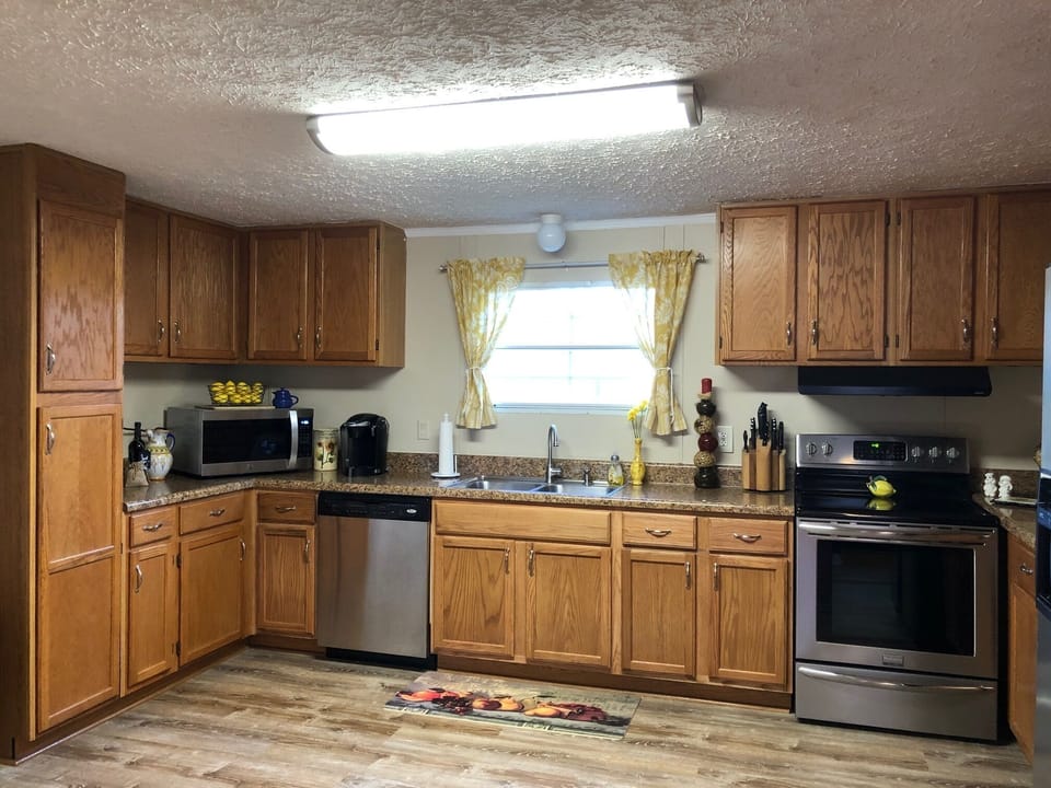 Kitchen with refrigerator, oven/range, and dishwasher