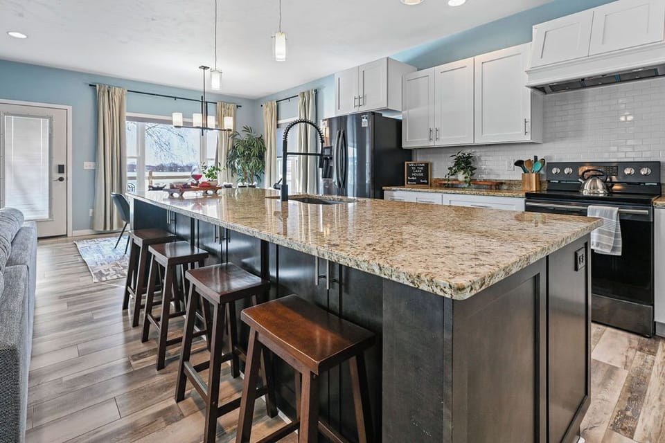 Spacious island with seating for four—ideal for morning coffee or happy hour. 