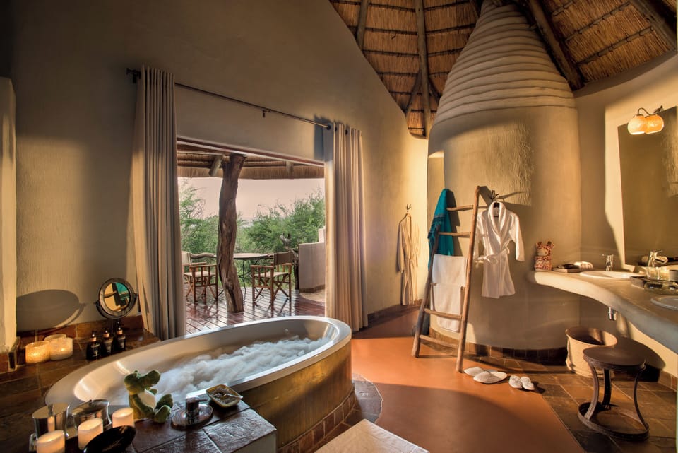 Lelapa Family Suite | Bathroom | Separate tub and shower, rainfall showerhead, designer toiletries