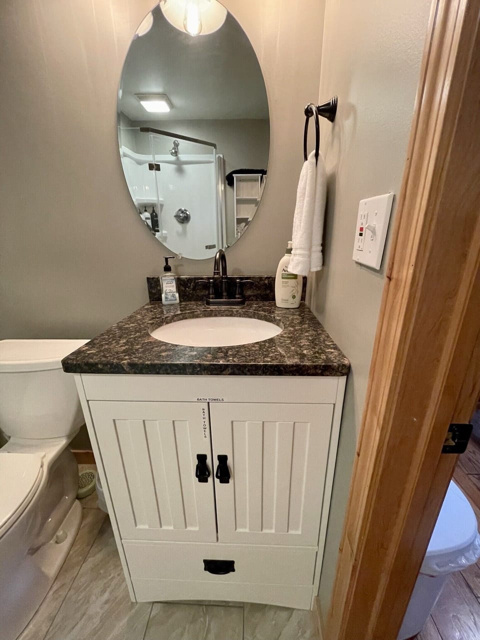 Full sized towels stored under the sink 