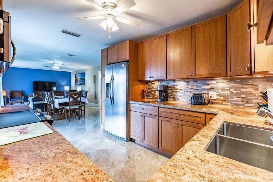 Indulge in the beauty of the updated kitchen, complete with stainless steel appliances and stunning granite countertops.