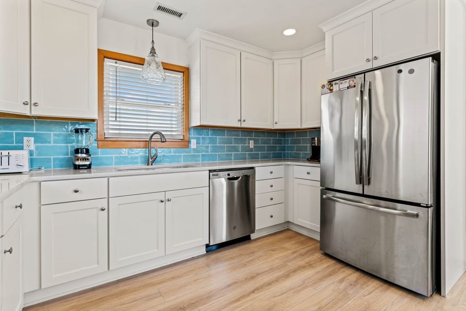 Kitchen with Bar Seating on Third Level