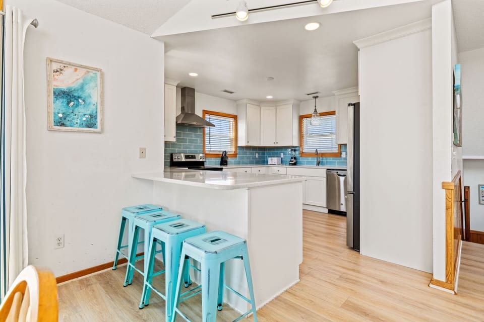 Kitchen with Bar Seating on Third Level