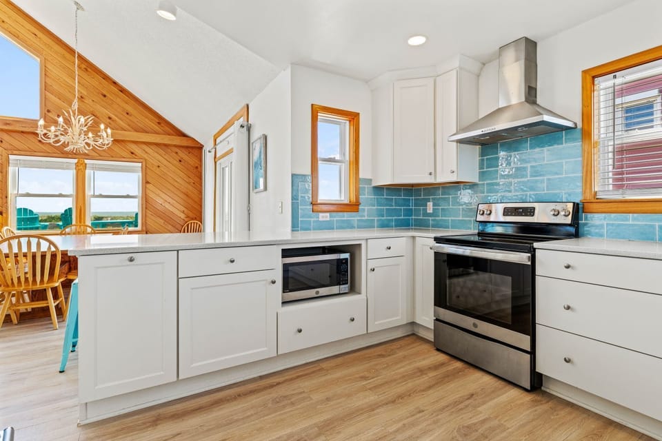Kitchen with Bar Seating on Third Level