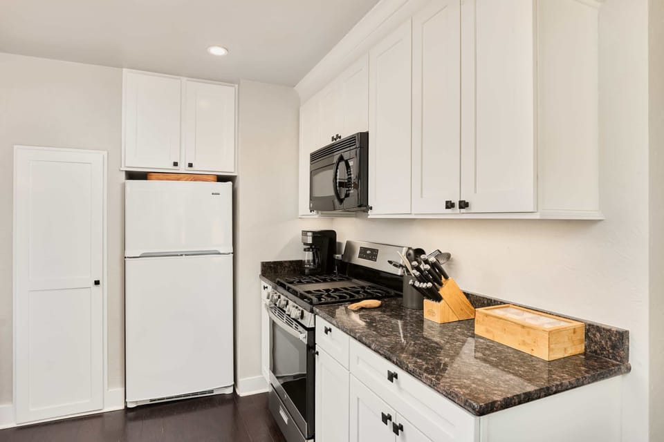 KitKitchen- gas stove and oven, fridge, sink, island, coffee and tea, pantrychen