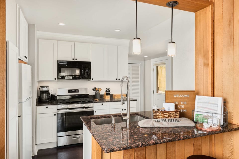 Kitchen- gas stove and oven, fridge, sink, island, coffee and tea, pantry