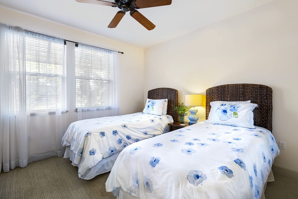 Bedroom 2 with Twin beds and nightstand.